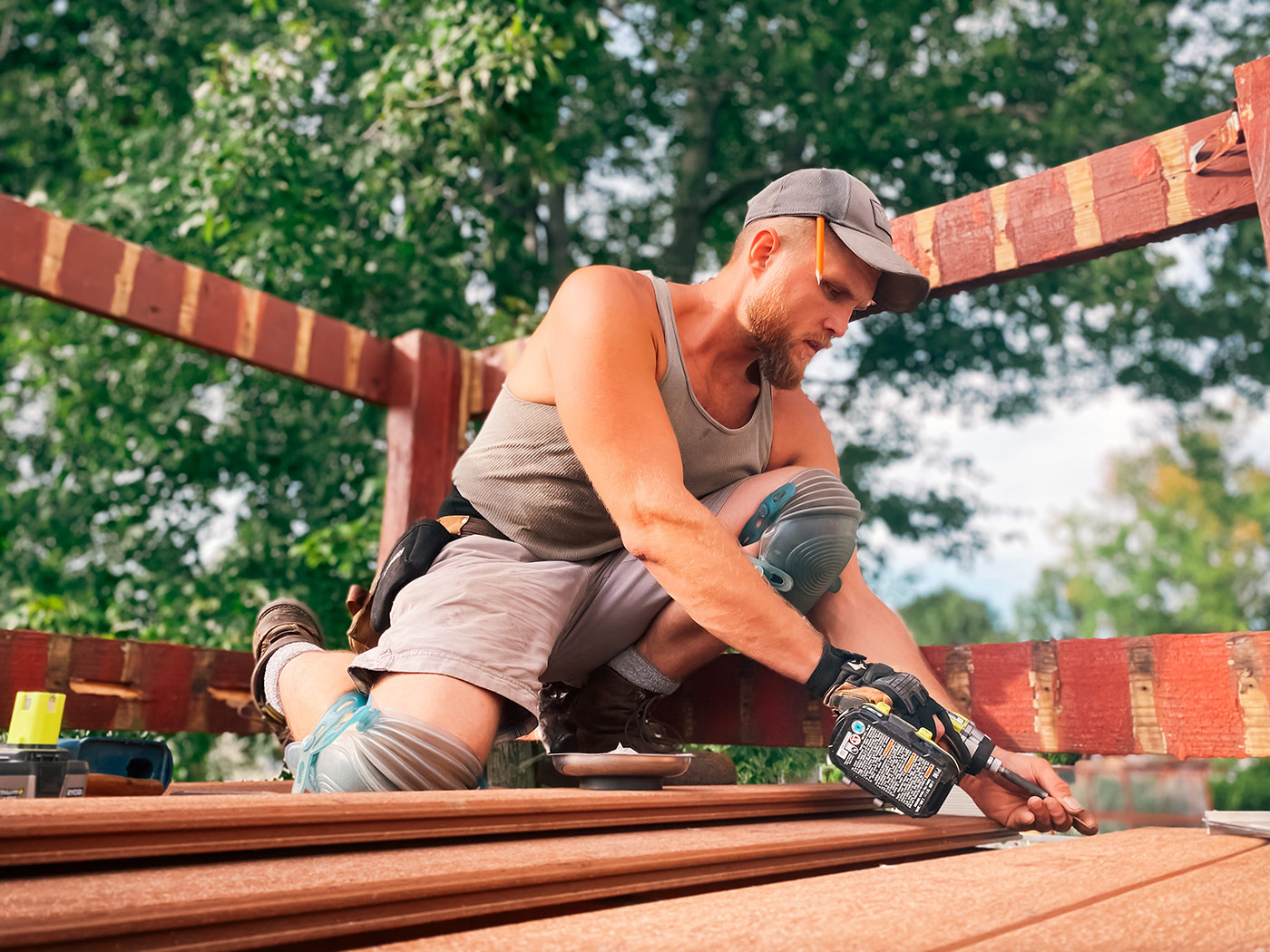 a-man-working-hard-building-a-deck-physical-work-2021-08-29-11-29-46-utc